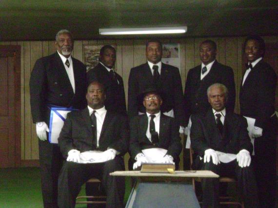 Brothers Andrew Taulton, Freddie Greer, Floyd King, Fred Smith, Karl Smith, Dana Busby, James Smith, and Dewain Jones.